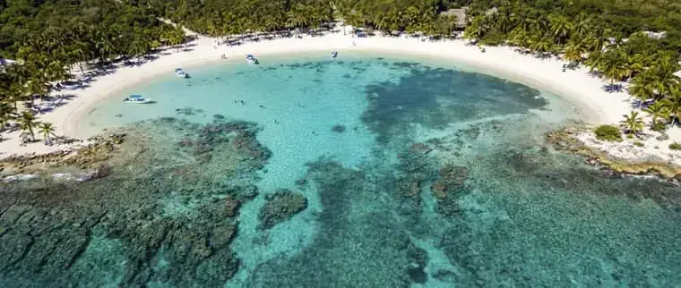 Aerial view of Akumal Bay turquoise lagoon and reef