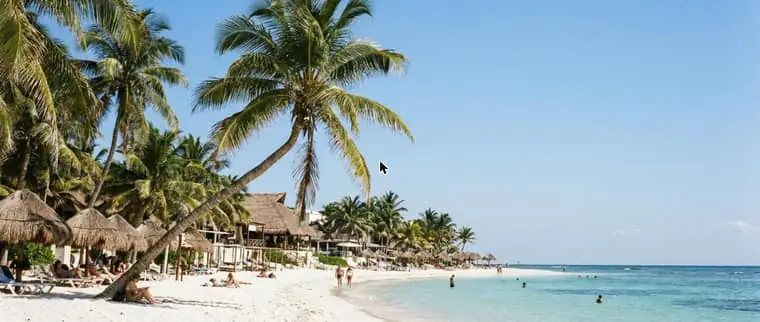 Playa del Carmen beach with turquoise water and palm trees
